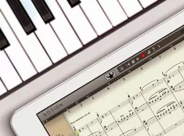 photo of piano and notes